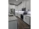 Modern kitchen with stainless steel appliances, granite counters, and white cabinetry at 0 Overton St, Orlando, FL 32833