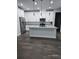 Modern kitchen features white cabinets, stainless steel appliances, and granite countertops at 0 Overton St, Orlando, FL 32833