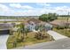A high angle view of a beautiful light-blue home, featuring a well-manicured lawn and lovely exterior at 10 Alicante Ct, Kissimmee, FL 34758