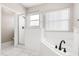 Bathroom featuring a soaking tub and separate shower with glass enclosure at 10 Alicante Ct, Kissimmee, FL 34758
