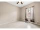 Bedroom features tile floors, light walls, ceiling fan, and window with curtains at 10 Alicante Ct, Kissimmee, FL 34758
