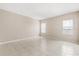 Spacious bedroom with tile floors and natural light from two large windows at 10 Alicante Ct, Kissimmee, FL 34758