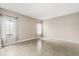 Bedroom features tile flooring, neutral paint, and two windows with curtains at 10 Alicante Ct, Kissimmee, FL 34758