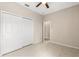 Bedroom featuring a closet, ceiling fan and tile floors at 10 Alicante Ct, Kissimmee, FL 34758