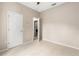 Bedroom features tile floors, light walls, closet and doorway to other rooms and laundry at 10 Alicante Ct, Kissimmee, FL 34758