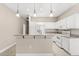 Bright kitchen features granite countertops, white cabinets, and stainless appliances at 10 Alicante Ct, Kissimmee, FL 34758
