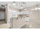 Bright kitchen with white cabinets, granite countertops, and stainless steel appliances at 10 Alicante Ct, Kissimmee, FL 34758