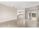 Open concept living room with tile floor and view of the kitchen at 10 Alicante Ct, Kissimmee, FL 34758