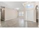 Spacious living room with tiled floors, high ceilings, and abundant natural light from the large front windows at 10 Alicante Ct, Kissimmee, FL 34758