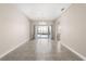 Living room with tiled floor, neutral paint, and sliding glass doors to the pool area at 10 Alicante Ct, Kissimmee, FL 34758