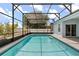Screened-in pool with clear water and covered patio at 10 Alicante Ct, Kissimmee, FL 34758