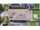 Aerial view of a home featuring a well-maintained roof, driveway, fenced yard and an inflatable pool at 10658 Bannan St, Orlando, FL 32832