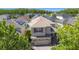Aerial view of the house showcases its location in a residential neighborhood with mature landscaping at 10658 Bannan St, Orlando, FL 32832