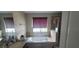This bathroom features a garden tub, a shower with glass door, and tiled floor at 10658 Bannan St, Orlando, FL 32832
