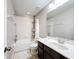 Clean bathroom features a vanity, tiled floor, shower-tub combo, and standard fixtures at 10658 Bannan St, Orlando, FL 32832