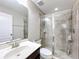 Modern bathroom featuring a tiled shower with glass door and a sleek vanity at 10658 Bannan St, Orlando, FL 32832