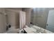 Clean, well-maintained bathroom with shower-tub combo and a vanity mirror at 10658 Bannan St, Orlando, FL 32832