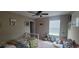 Brightly lit bedroom with a single bed, a ceiling fan, and playful decor and a window at 10658 Bannan St, Orlando, FL 32832