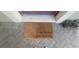 Welcome guests with a 'So Happy You're Here' doormat on a brick porch, adding charm and hospitality at 10658 Bannan St, Orlando, FL 32832