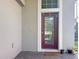 Front door area featuring an elegant glass door, brick flooring and a welcome mat at 10658 Bannan St, Orlando, FL 32832