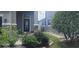 Inviting front entrance with stone accents and lush landscaping creating curb appeal at 10658 Bannan St, Orlando, FL 32832