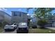 Charming two-story home with a well-maintained lawn and paved driveway and a 2-car garage at 10658 Bannan St, Orlando, FL 32832