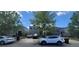 A street view of a neighborhood with houses, cars parked on the street and in the driveway at 10658 Bannan St, Orlando, FL 32832
