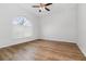 Bedroom with large arched window providing natural light at 11255 Se 170Th Pl, Summerfield, FL 34491