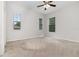 Bedroom with carpet, ceiling fan, and multiple windows with blinds at 11255 Se 170Th Pl, Summerfield, FL 34491