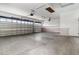 Spacious garage with high ceilings, two car doors, and built in cabinets for storage at 11255 Se 170Th Pl, Summerfield, FL 34491