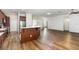 Open kitchen and living area with island seating and stainless steel appliances at 11255 Se 170Th Pl, Summerfield, FL 34491