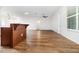 Spacious living room with hardwood floors, ceiling fan, and natural light at 11255 Se 170Th Pl, Summerfield, FL 34491
