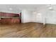 Spacious open-concept living area boasts modern finishes and vinyl floors, seamlessly connecting to the kitchen at 11255 Se 170Th Pl, Summerfield, FL 34491