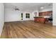 Open-concept living area features vinyl floors, recessed lighting, and a smooth transition to the kitchen and outdoor spaces at 11255 Se 170Th Pl, Summerfield, FL 34491