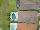 Overhead view of residences with beautiful private pools, well-maintained lawns, and lush landscaping at 13139 Stanthorne Ave, Orlando, FL 32832