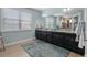 Bathroom with granite countertops, double sinks, and a large mirror at 13139 Stanthorne Ave, Orlando, FL 32832