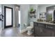 Contemporary bathroom featuring granite counters, wood-look tile floors and modern fixtures at 13139 Stanthorne Ave, Orlando, FL 32832