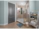 Bright bathroom featuring a glass-enclosed shower and stylish ladder shelf at 13139 Stanthorne Ave, Orlando, FL 32832