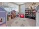 bedroom featuring whimsical decor, a dollhouse, and ample space for play and creativity at 13139 Stanthorne Ave, Orlando, FL 32832