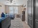 Charming bedroom featuring twin beds, ceiling fan, and a stylish black and white patterned rug at 13139 Stanthorne Ave, Orlando, FL 32832