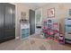 Cozy ' bedroom with decorative rug, playful decor, and ample storage space at 13139 Stanthorne Ave, Orlando, FL 32832