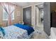 Stylish bedroom showcasing the window, closet, and modern decor with comfortable furnishings at 13139 Stanthorne Ave, Orlando, FL 32832