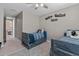 Comfortable bedroom featuring twin beds, carpeted floor, and sporty wall decor at 13139 Stanthorne Ave, Orlando, FL 32832
