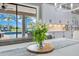 Light-filled dining area with a view of the pool area and backyard, complemented by stylish white floral arrangement at 13139 Stanthorne Ave, Orlando, FL 32832