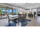 Dining area with table and view of the screened outdoor living space and pool at 13139 Stanthorne Ave, Orlando, FL 32832