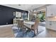 Elegant dining room featuring a table, decor, and view of the screened outdoor living space and pool at 13139 Stanthorne Ave, Orlando, FL 32832