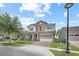 Beautiful home with stone accents, a two-car garage, and a well-maintained lawn on a sunny day at 13139 Stanthorne Ave, Orlando, FL 32832