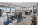Open floor plan featuring a kitchen and dining area that offer natural light and backyard views at 13139 Stanthorne Ave, Orlando, FL 32832