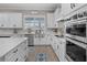 Bright kitchen with stainless steel appliances, white cabinets, and a large island perfect for cooking and entertaining at 13139 Stanthorne Ave, Orlando, FL 32832