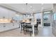 Gourmet kitchen with large island, white cabinets, stainless steel appliances, and tile backsplash at 13139 Stanthorne Ave, Orlando, FL 32832